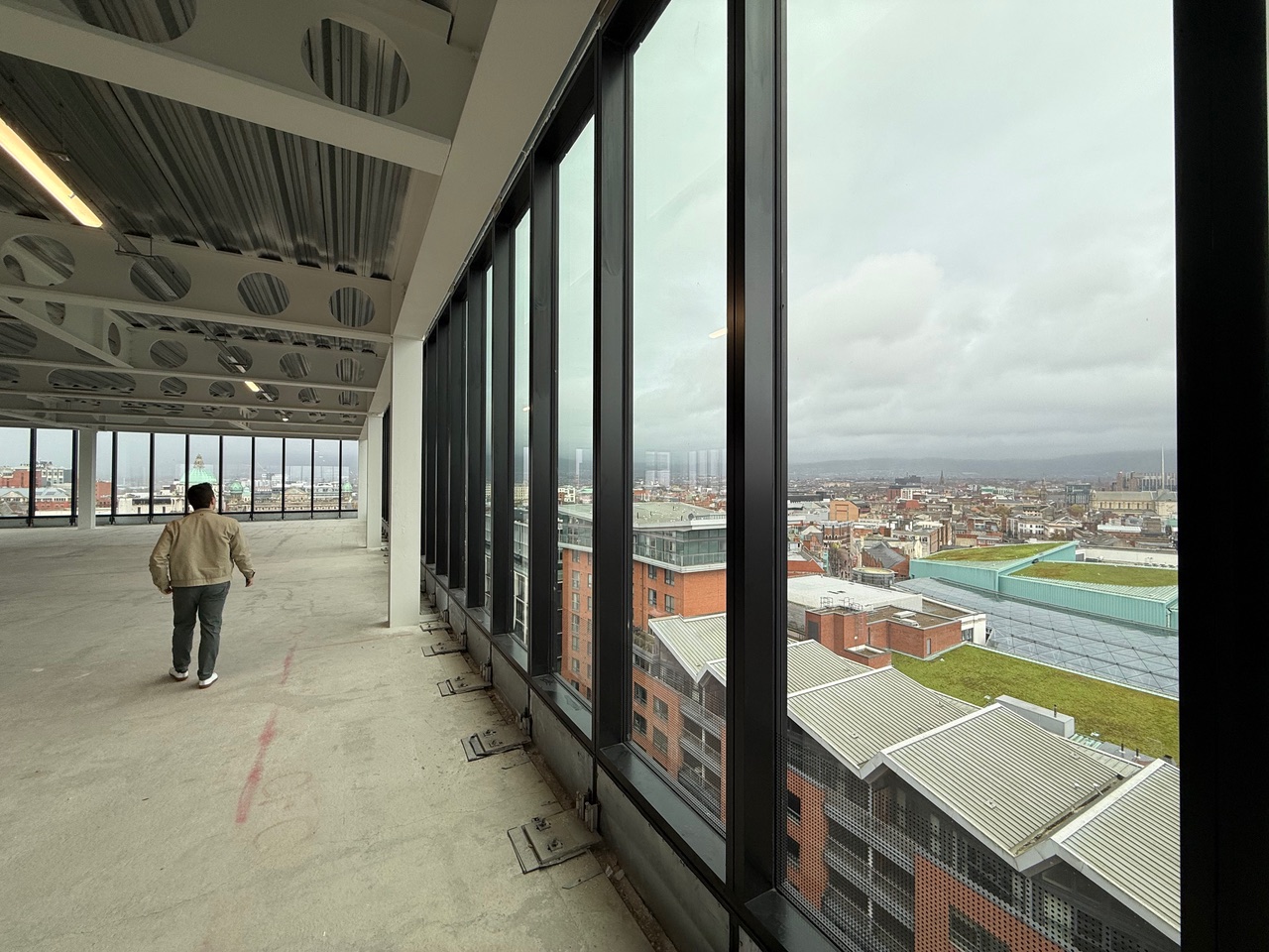 Paper Exchange empty floor, glazing to Belfast skyline